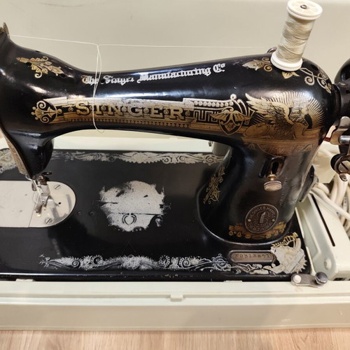 Singer vintage sewing machine with motor and case