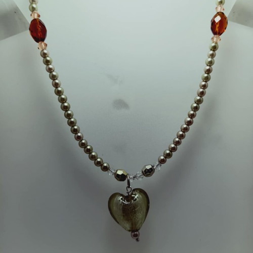 Necklace with white beads and greenish heart, new