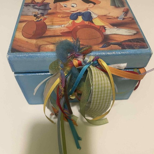 Wooden box with Pinocchio figure used