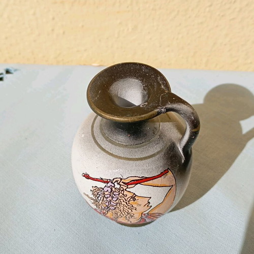Small amphora new, black color with design and one handle