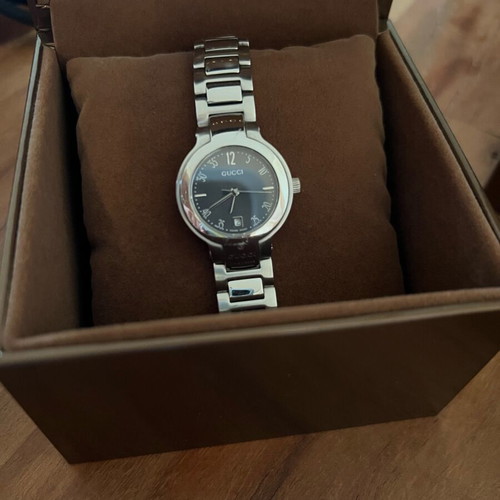 Gucci women's watch silver like new with box and booklet