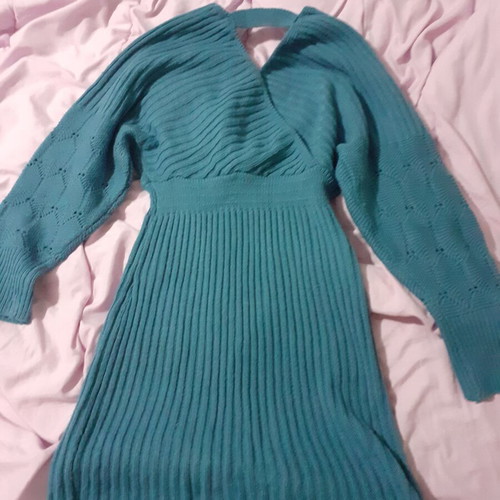Knitted blue dress new with perforated sleeve designs and back opening size M