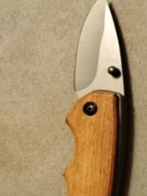 Folding knife with wooden handle like new