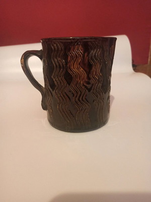 Vintage mug with embossed wavy design like new