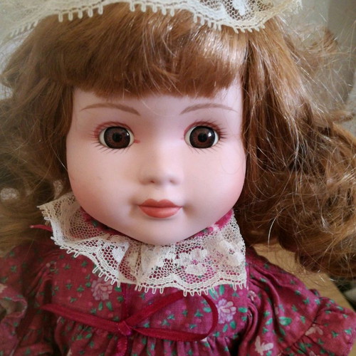 Porcelain doll used, 38cm tall with clothes and shoes