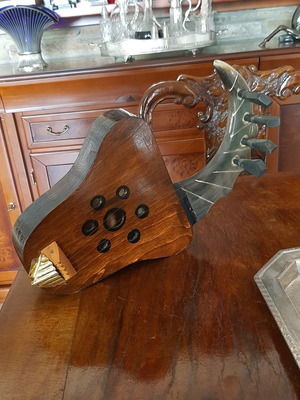African string instrument used, made of animal horn and wood