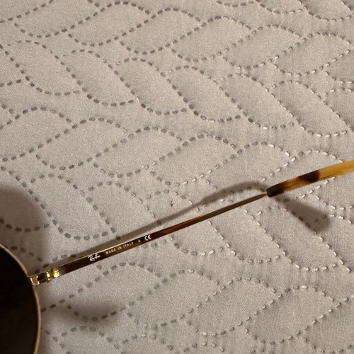 Ray-Ban Oval sunglasses used with gold frame and gray lenses
