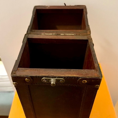 Decorative wooden case used with leatherette for bottle storage