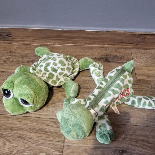 Plush turtles set of 2 like new, one is a case
