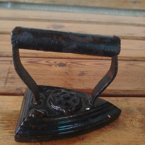 Old cast iron clothes iron used