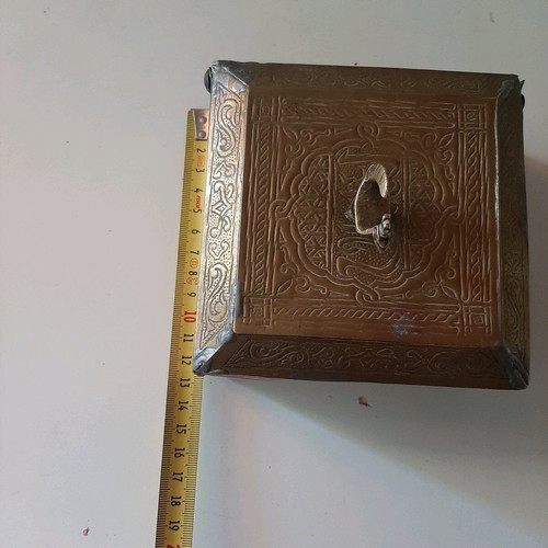 Oriental copper box used with carved decorations