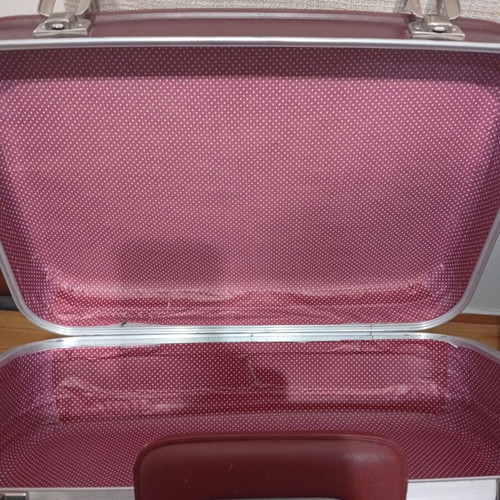 Vintage travel suitcase used, burgundy leather exterior