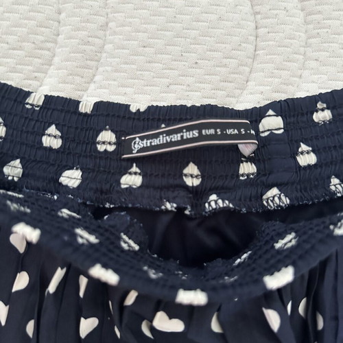 Stradivarius mini skirt with hearts, size S