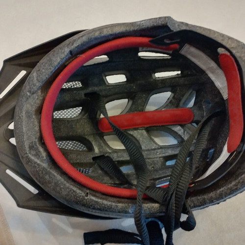 Bicycle helmet used, teen size 54-58 cm with left side wear