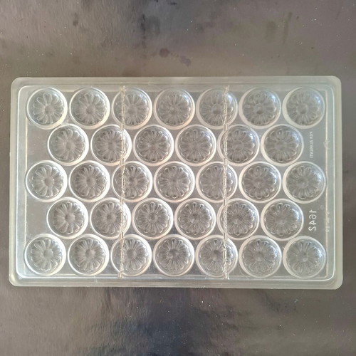 Polycarbonate chocolate mold used, 33 cavities, flower daisy design