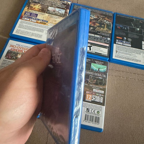 PS Vita game set of 6 like new, including Blazblue, DBZ, Soul Sacrifice
