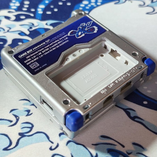 Silver Gameboy Advance SP shell with embossed Kyogre UV print