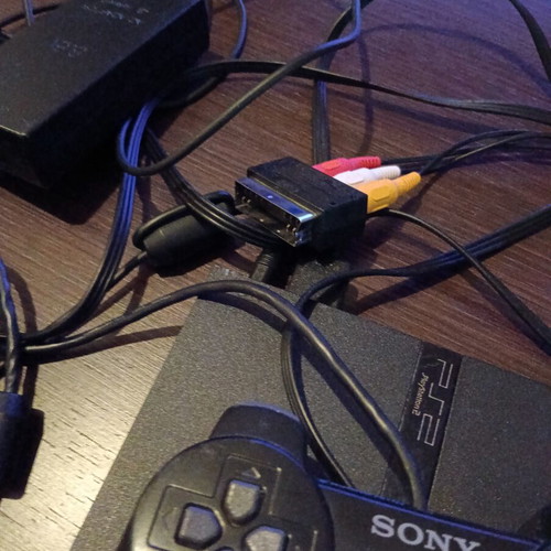 Sony PlayStation 2 console with memory card and remote