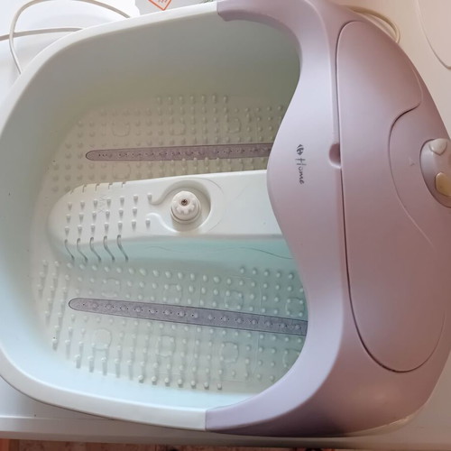 Foot Bath used with heating, bubbles, and massage functions