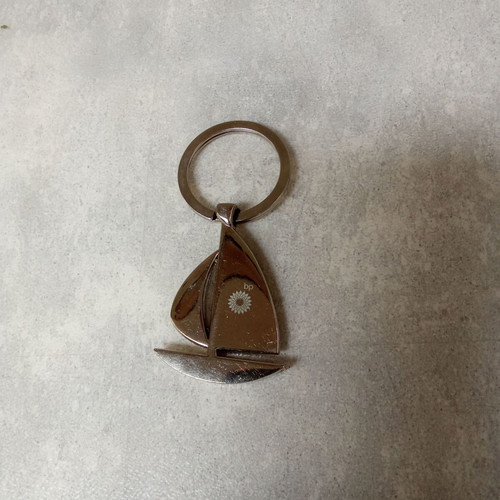 Keychain sailboat BP used, silver, 2000s decade