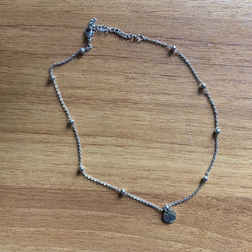 Steel necklace with letter alpha like new