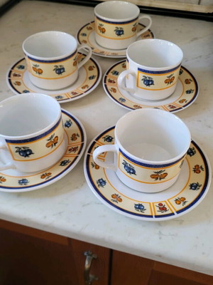 Set of cups and dessert plates used, 5 cups and 6 plates
