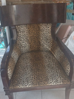 Classic wooden armchair with animal print upholstery, like new