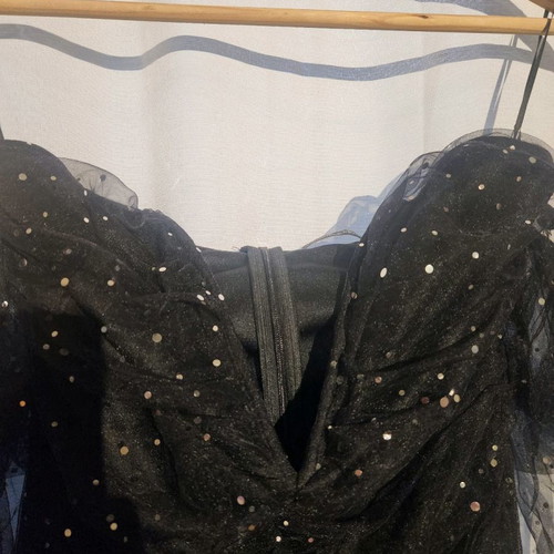 Black evening dress with V neckline and sheer sleeves in very good condition