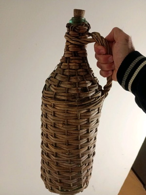 Demijohn with woven cover used