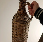 Demijohn with woven cover used