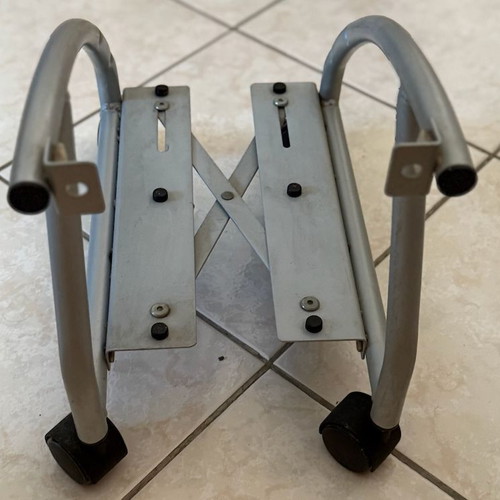 Metal computer tower stand used with wheels