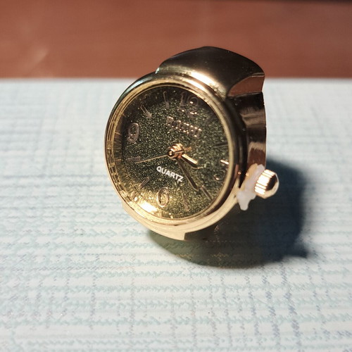 Ring watch quartz with khaki dial and gold bracelet like new