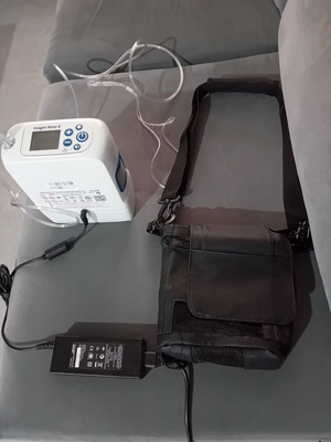 Portable Oxygen Concentrator like new with charger and carrying case