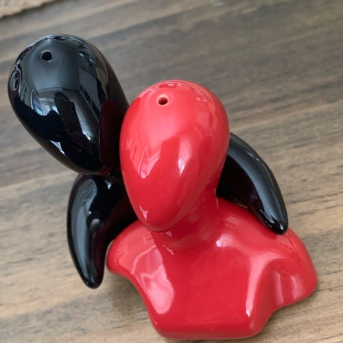 Salt and pepper shakers hugging pair like new
