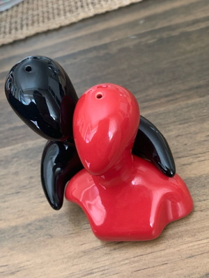 Salt and pepper shakers hugging pair like new