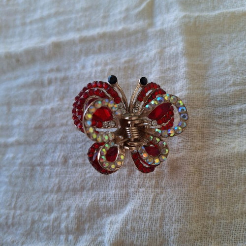 Small butterfly hair clip used with red rhinestones