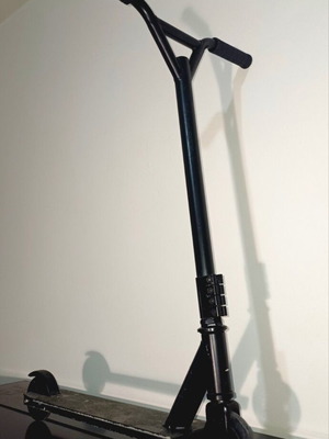 Black two-wheel scooter with rear brake