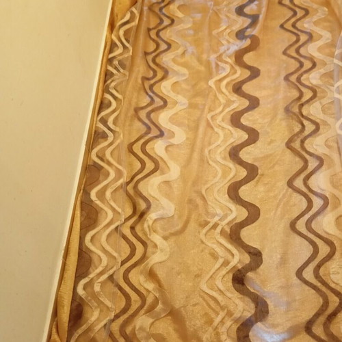 Double curtain like new with gold and geometric patterns