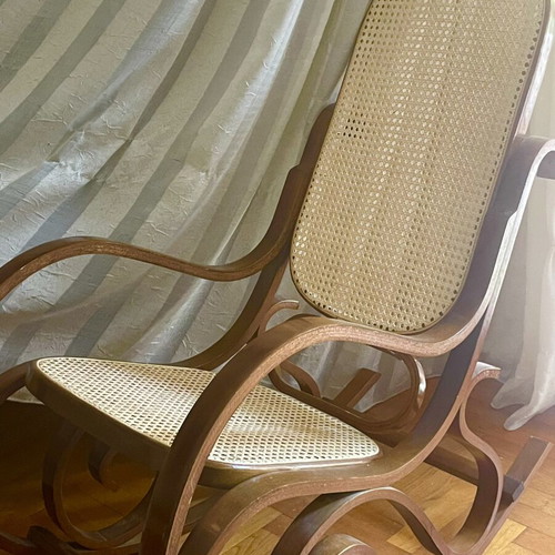Wooden rocking chair with cane seat, walnut finish