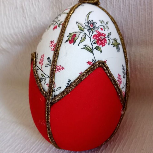 Geometric decorative egg used, red and floral design