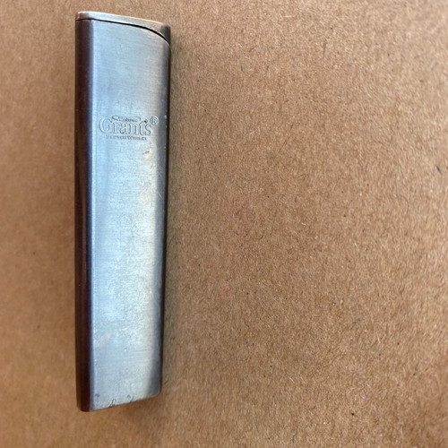 Grants lighter used with visible wear marks