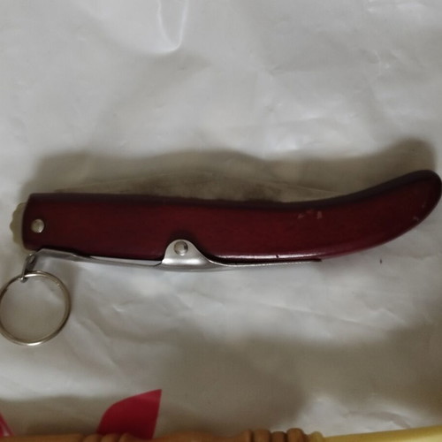 Okapi folding knife with rosary gift, like new