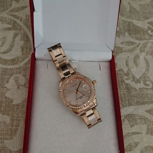 Oxette women's waterproof quartz watch with pink gold stainless steel bracelet and rhinestone bezel like new