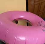 Pink inflatable pool float with glitter