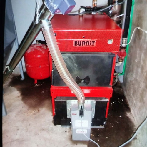Pellet and wood boiler used with silo