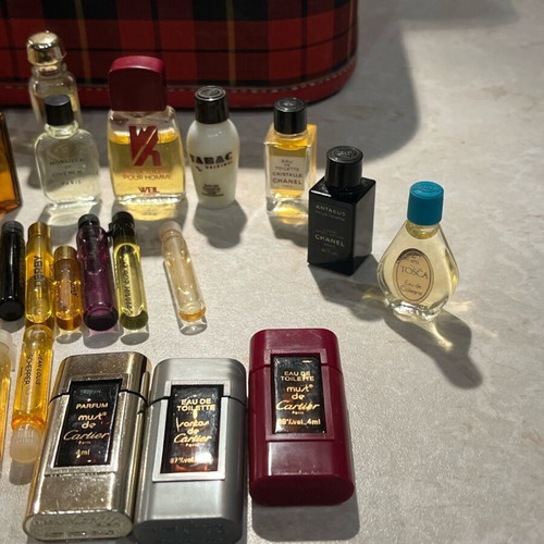 Filled vintage women's perfume vials from 1960-1990