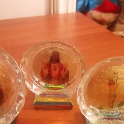 Small religious desk icons: Virgin Mary, Jesus, Crucifixion