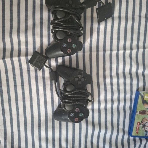 PlayStation 2 Slim console like new with 2 controllers, 2 games, and memory card