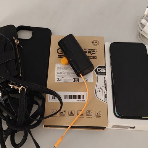 iPhone 13 128GB used with charger, earphones, cases, and power bank