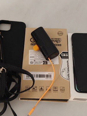 iPhone 13 128GB used with charger, earphones, cases, and power bank
